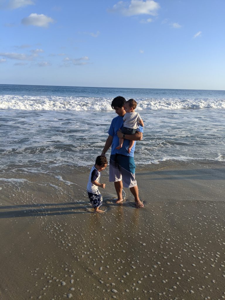 Man and kids on the beach near Hyatt Ziva Los Cabos