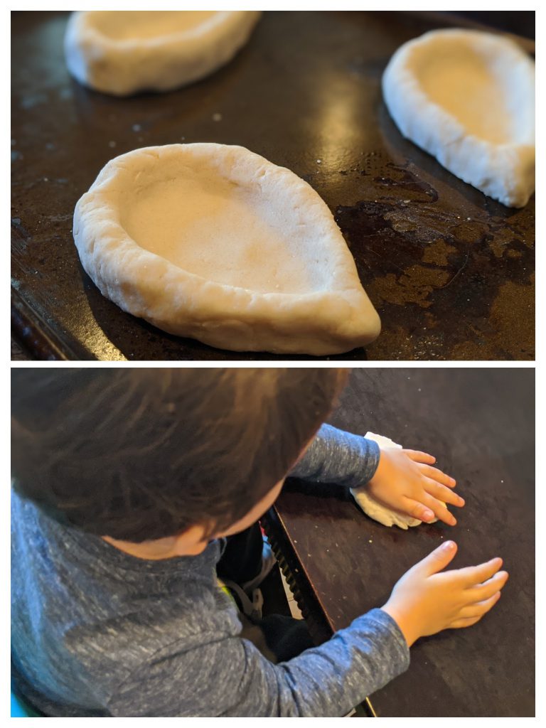 Young boy using dough to make diyas