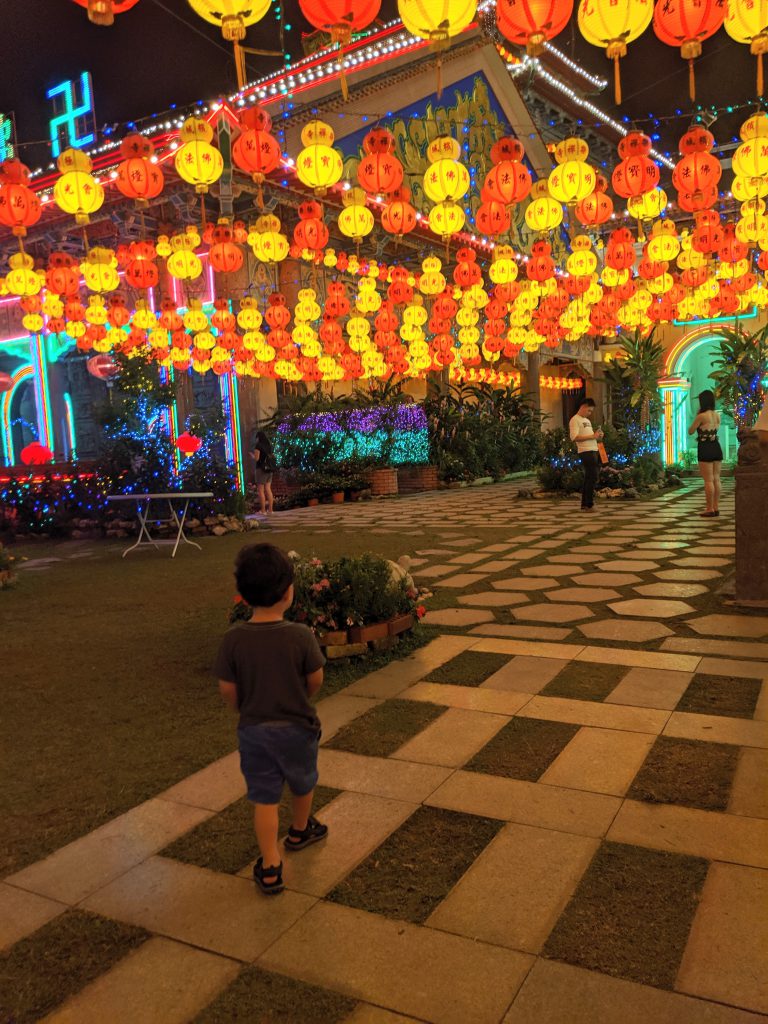 A courtyard in Kek Lok Si Temple lit with lanterns