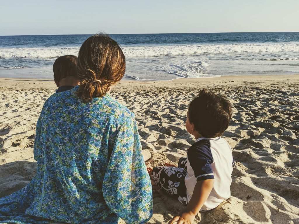 Woman and kids on the beach near Hyatt Ziva Los Cabos- best Cabo resorts for families