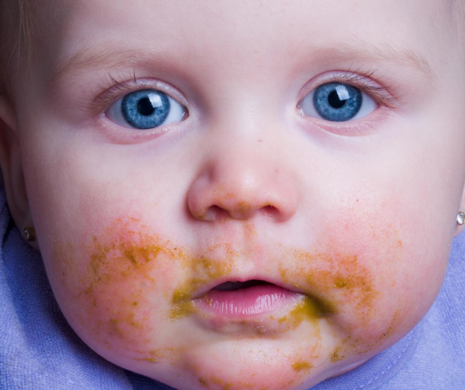 Baby with food on his face