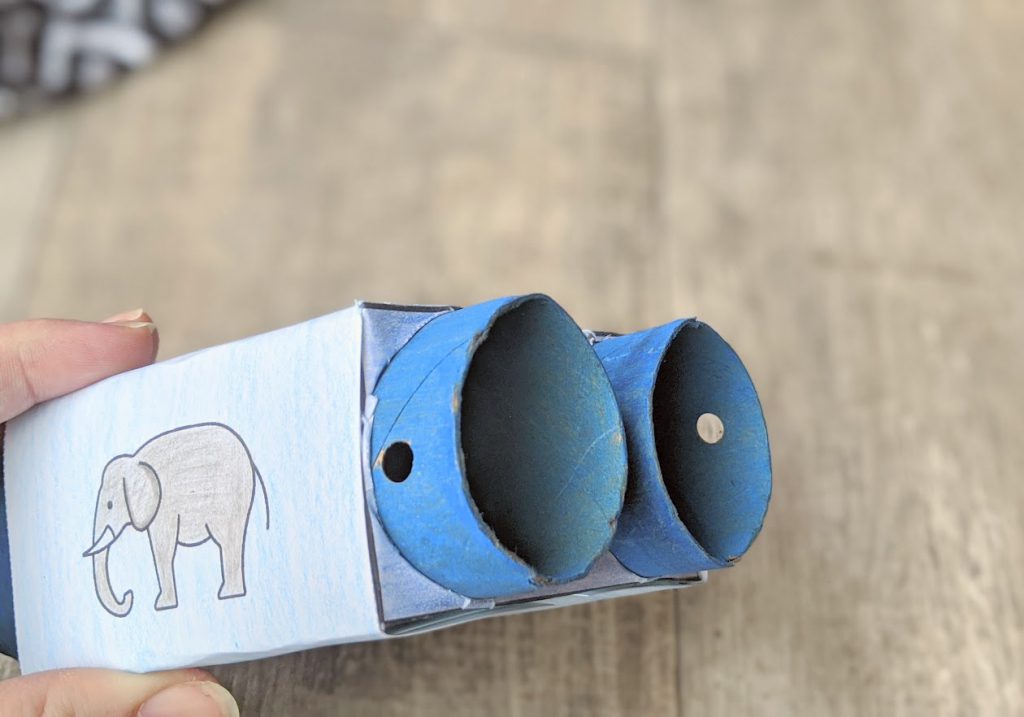 Punch holes into the toilet paper rolls for the string to attach the binoculars kids craft