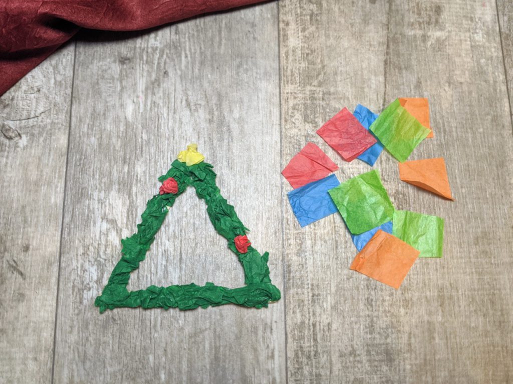 Use tissue paper to make a star and ornaments on the tree ornament