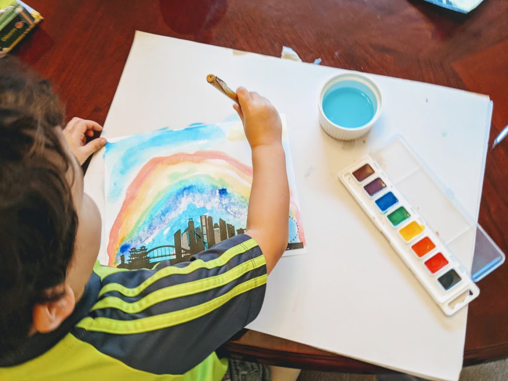 Preschooler painting a Singapore city skyline printable