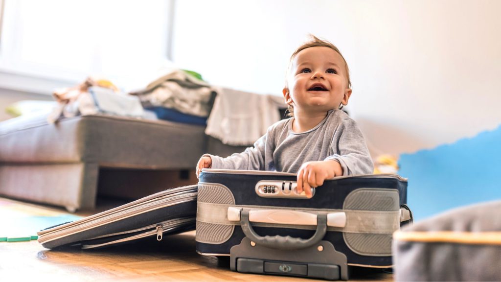 Baby in a suitcase for travel