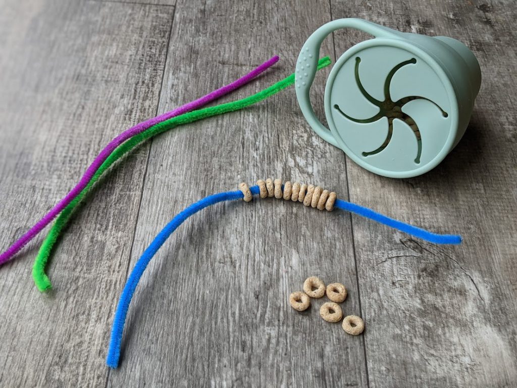 Cereal on a pipe cleaner- toddler airplane activities