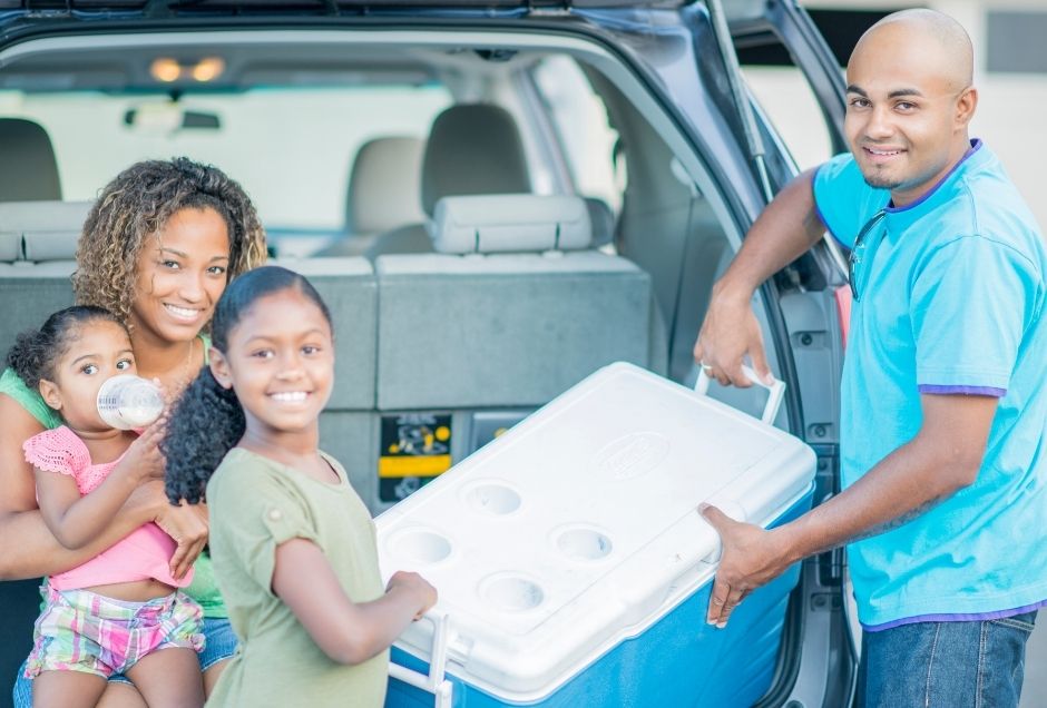 Family with a cooler of food