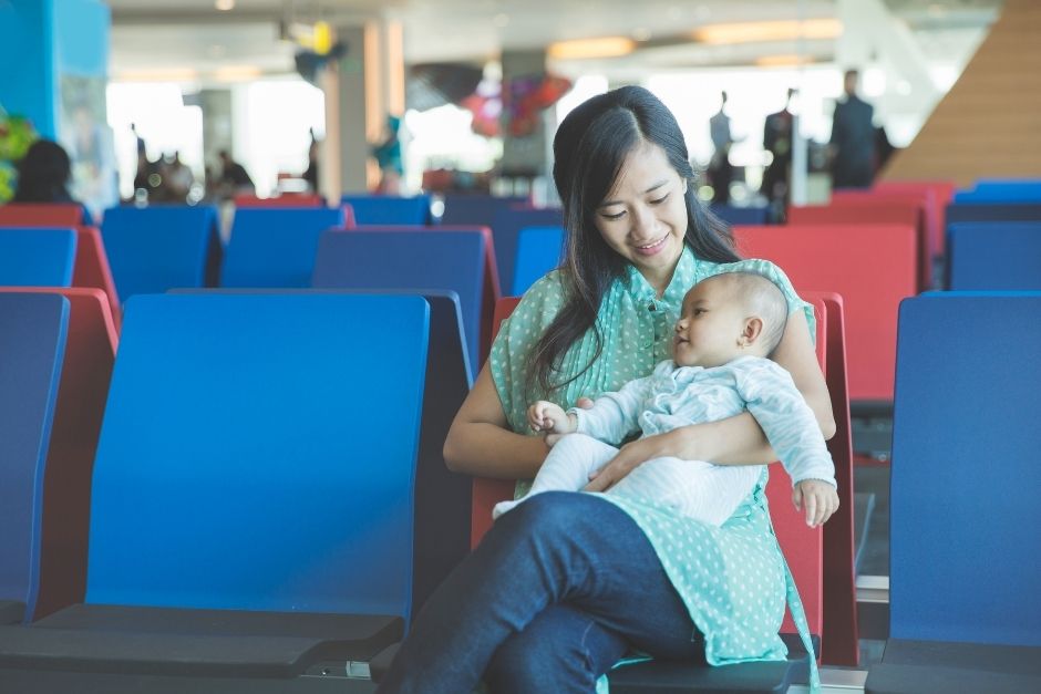 Woman and baby at the airport- first flight with baby