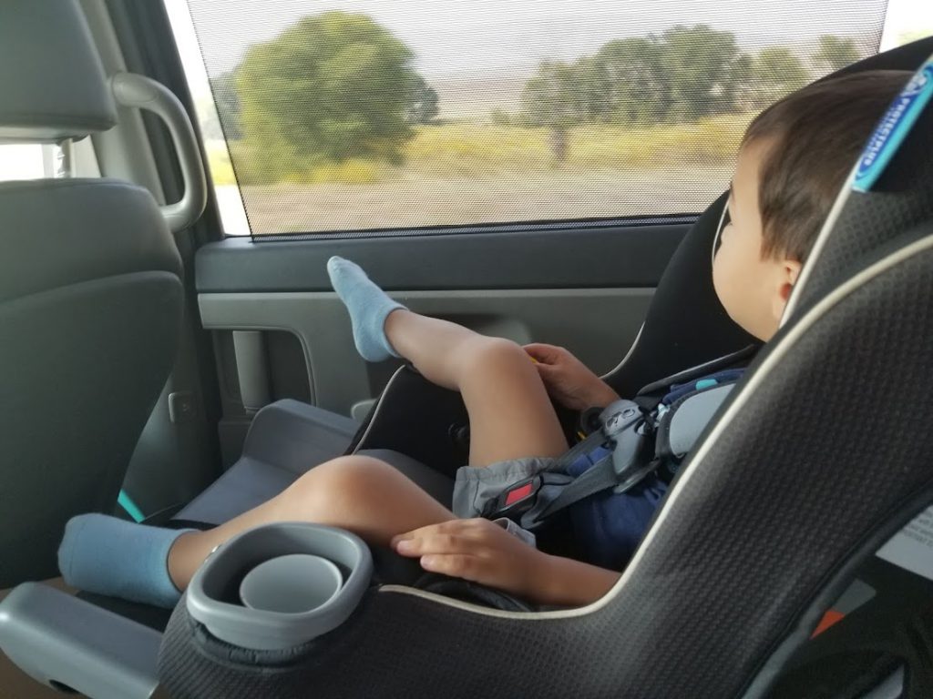 Child in a car seat- road trip with a toddler 