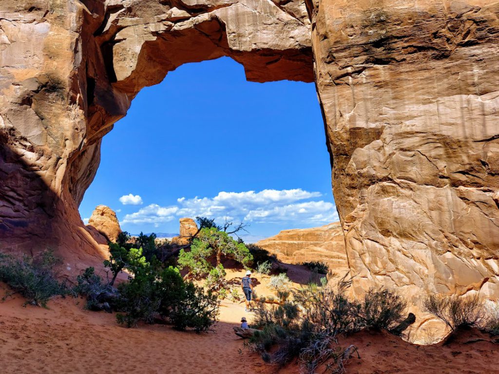 Man and child at an Arch in Arches National Park