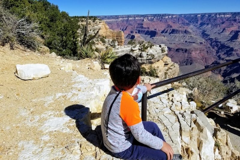 Child looking out over the Grand Canyon- Grand Canyon with kids