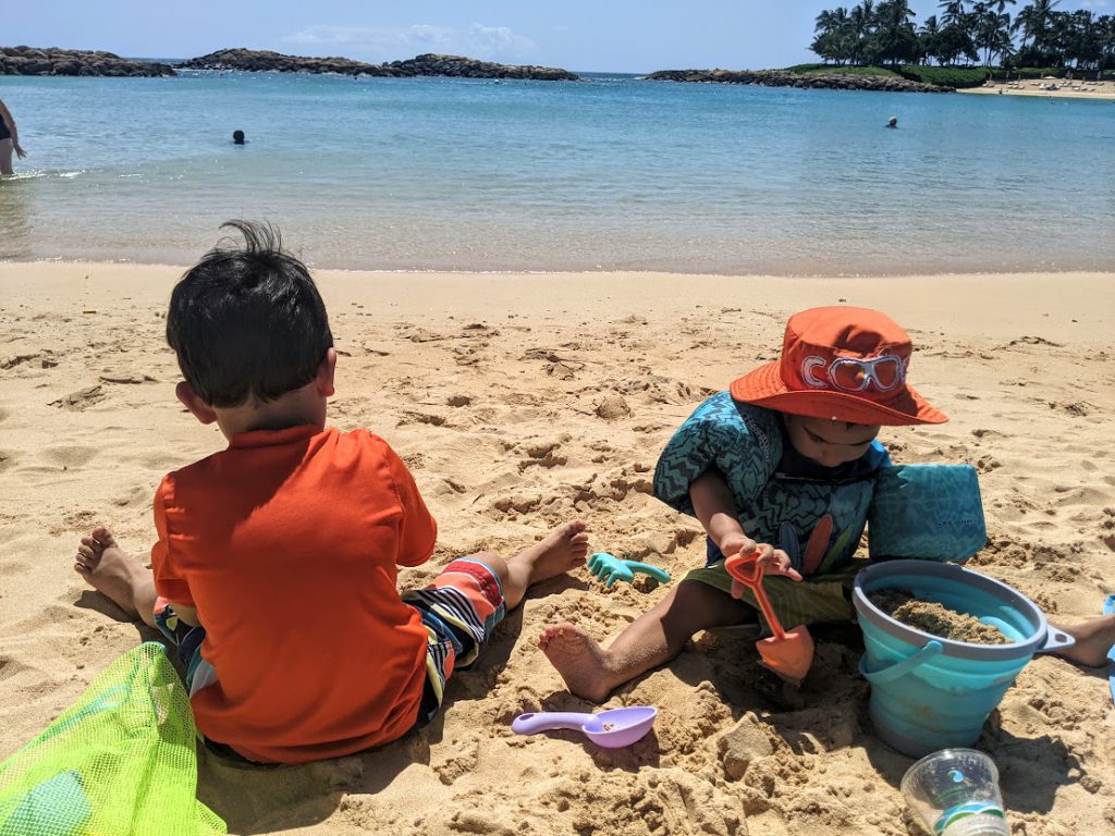 Kids playing with beach toys