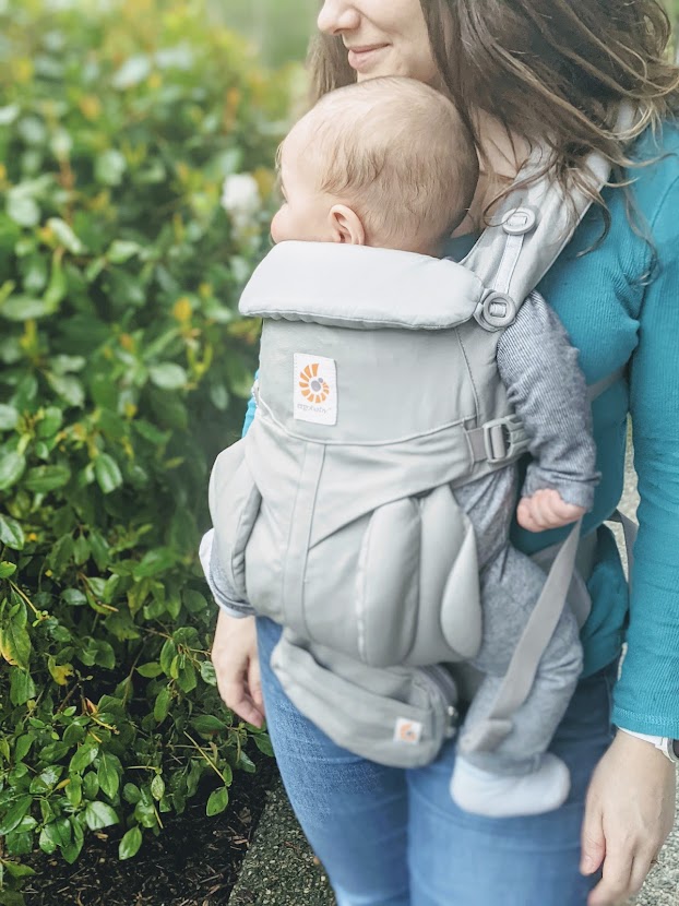 Baby in an Ergobaby carrier- nursing in a baby carrier
