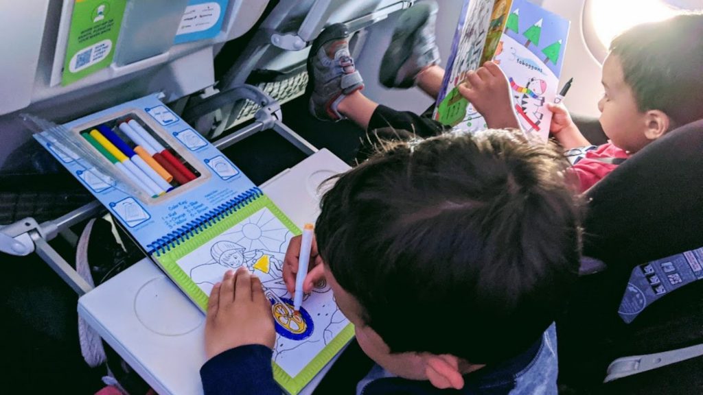 Kids drawing on a plane