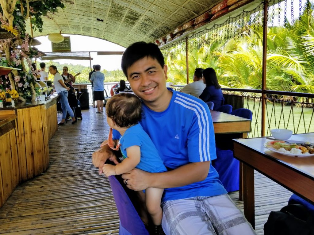 Dad and baby on a river cruise in Bohol, Philippines