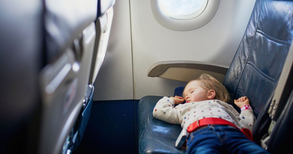 Child sleeping on a plane