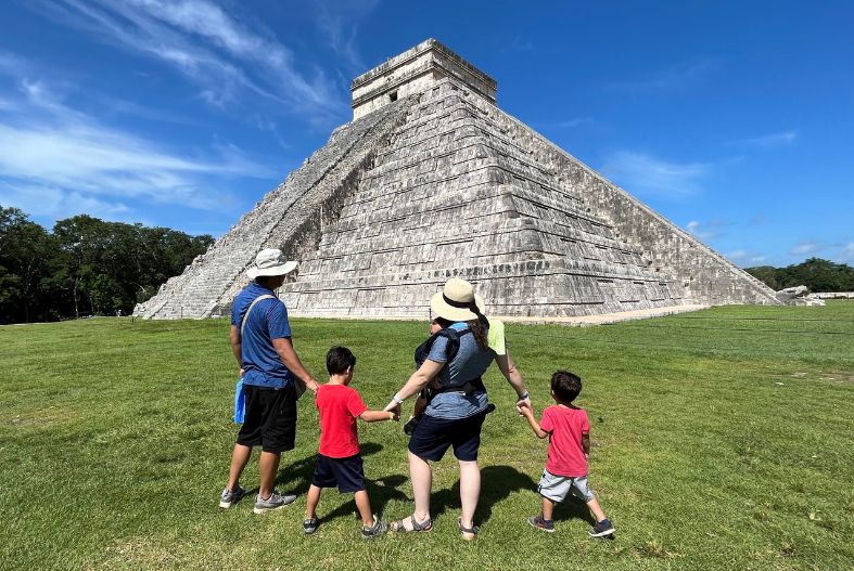 A family in front of of El Castillo 