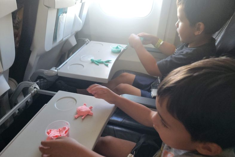 Kids playing with magic clay on the plane