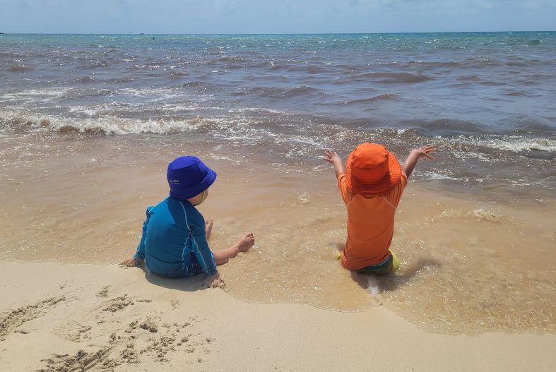 Kids playing on the beach in Playa del Carmen