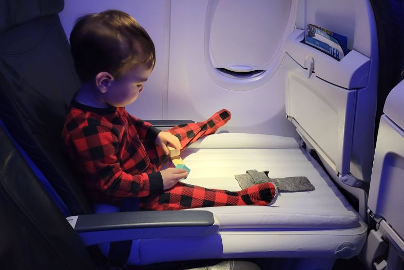 Child sitting on a Flyaway Kids Bed