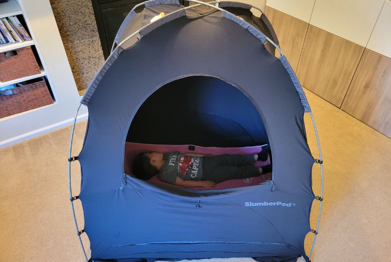 Child on a Regalo MyCot in the SlumberPod