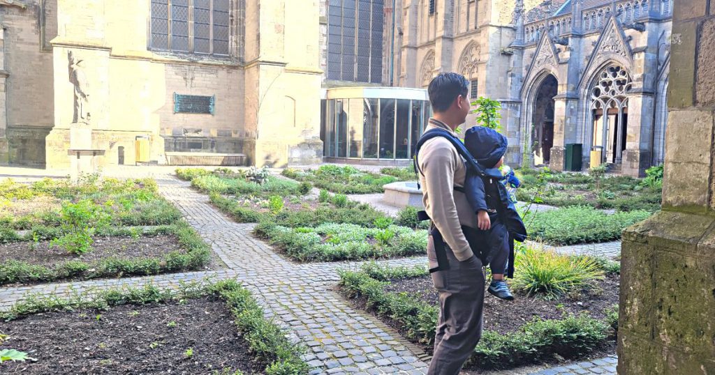 Man carrying a toddler in an Ergobaby Omni 360 carrier