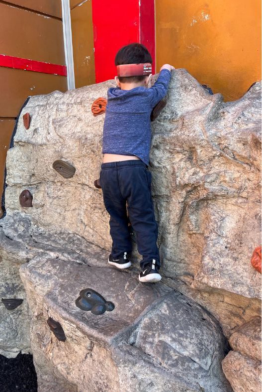 Child rock climbing