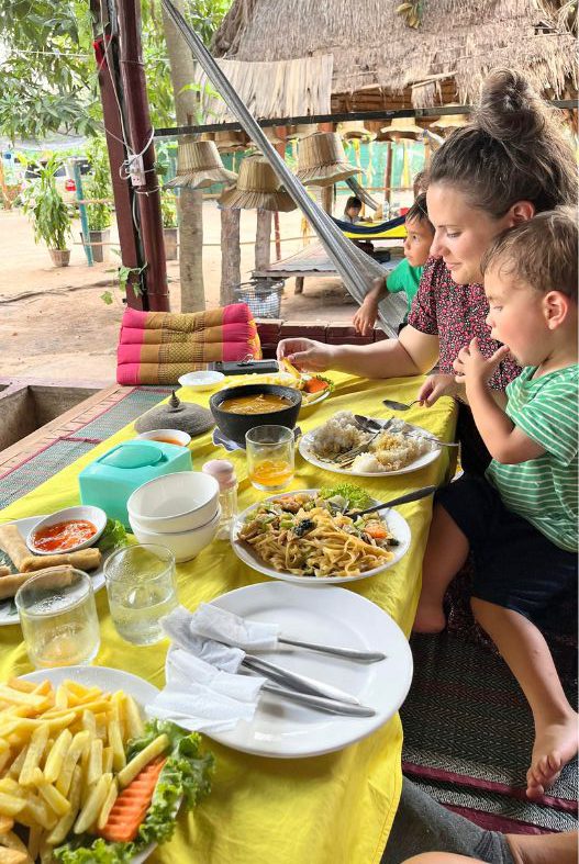 Family eating food in Cambodia