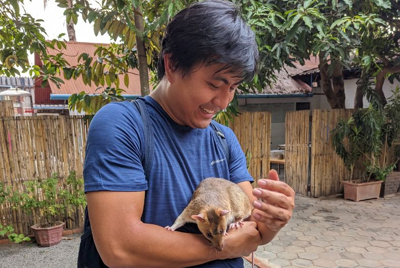 Man holding a rat at APOPO