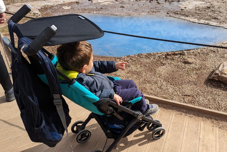 Child in a gb Pockit stroller