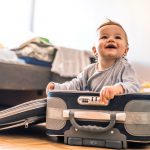 Baby in a suitcase for travel