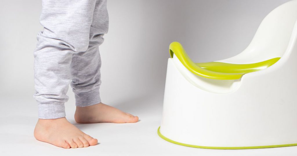 Toddler with a potty